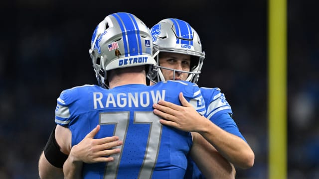 Detroit Lions quarterback Jared Goff greets center Frank Ragnow
